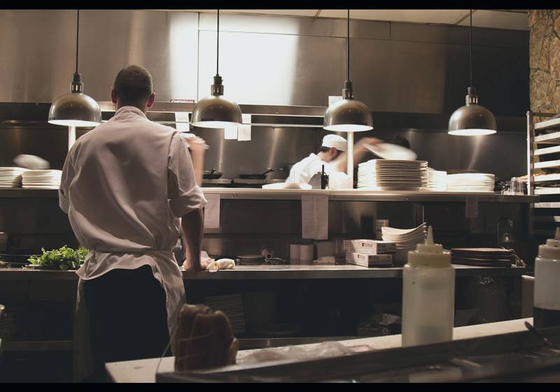 Chefs at work in a restaurant kitchen