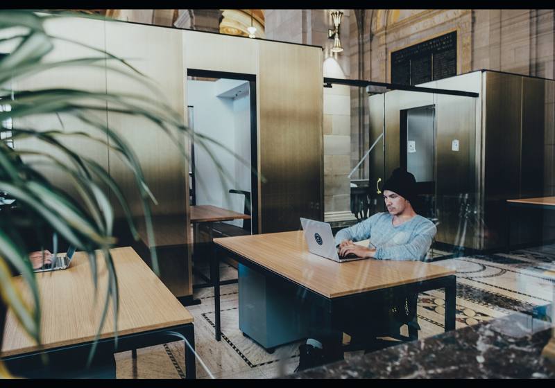 Open office with a person at a laptop